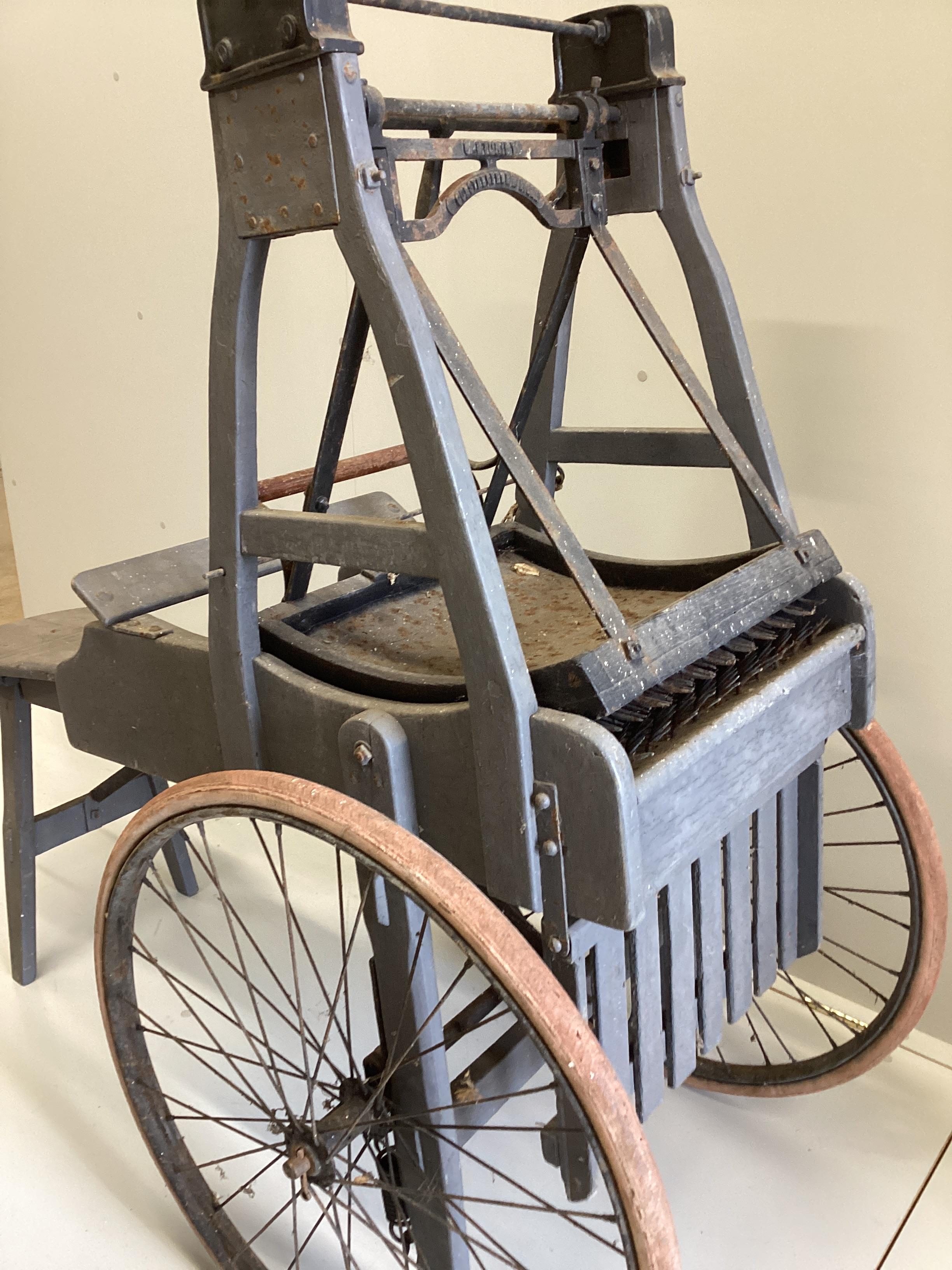 A late 19th / early 20th century French painted wood and iron wool threshing cart, length 146cm, height 131cm